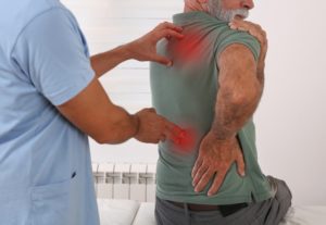 A man visits the chiropractor after a car accident