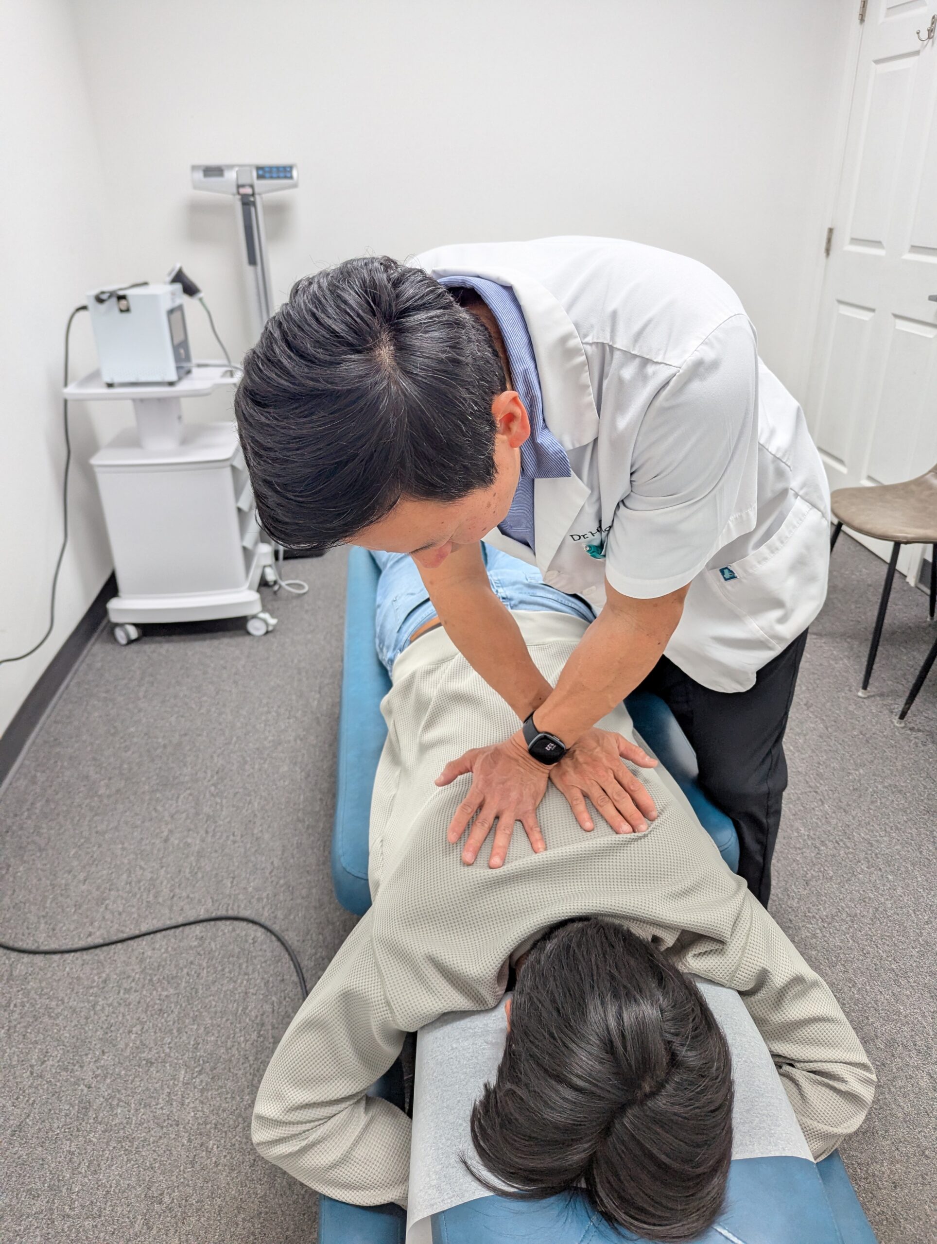 Dr. Hyung Pak providing chiropractic treatment for chronic headaches and neck pain