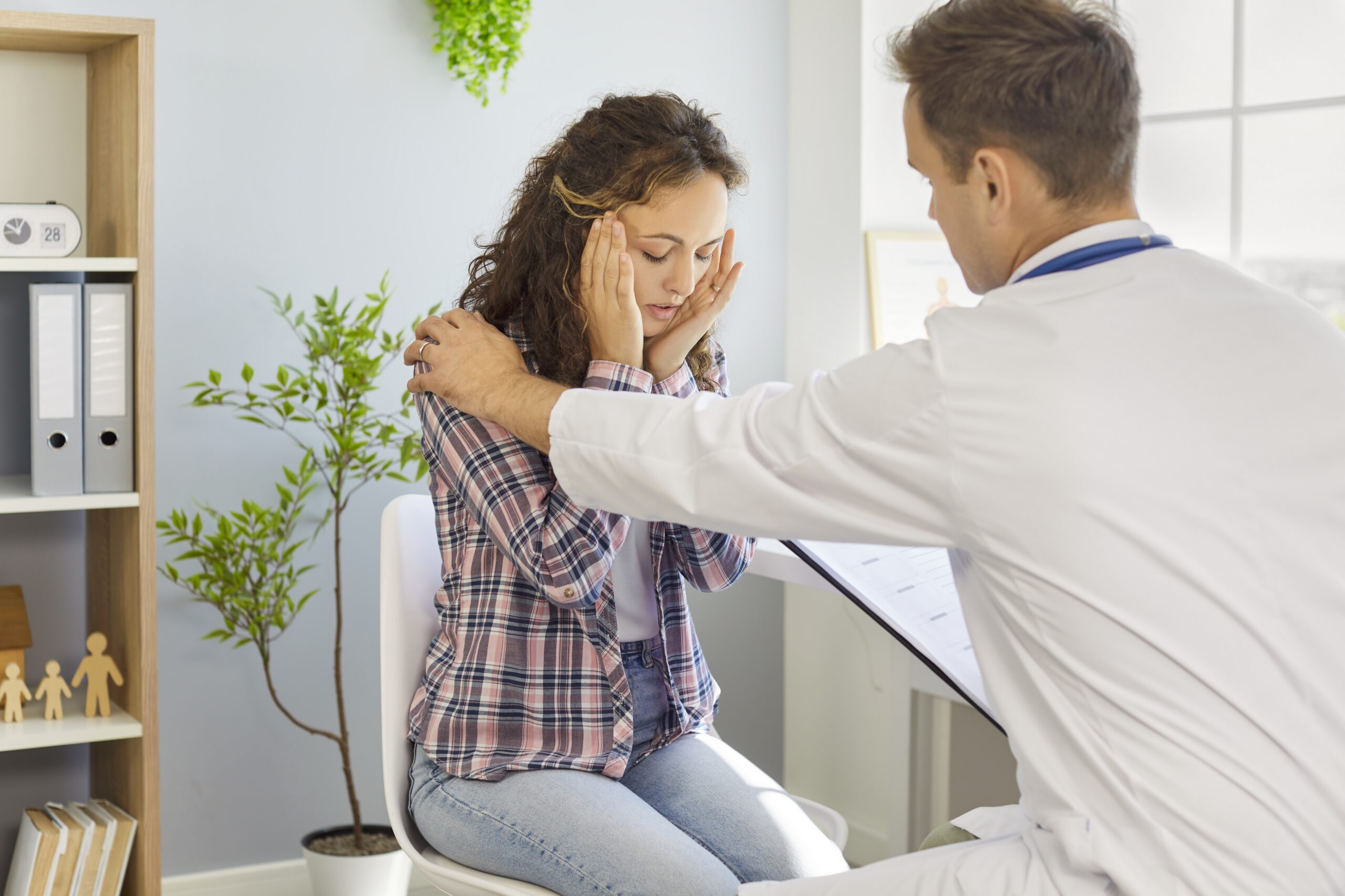 Doctor evaluating a patient experiencing recurring headaches